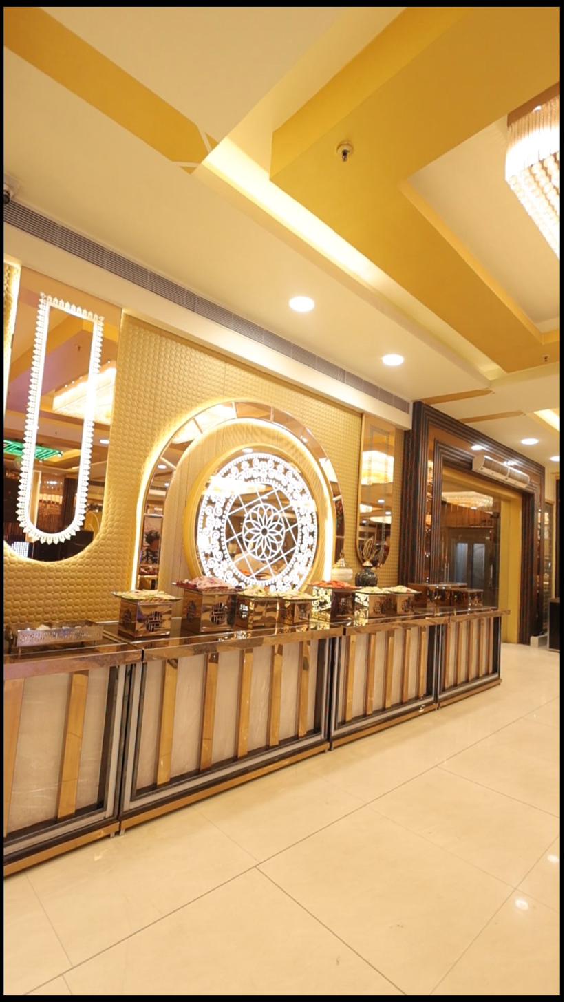 Premium gold food counter with chandelier — The Great Palace Banquet Hall corporate catering